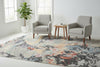 Multicolored abstract patterned rug with a mix of colors on a plain background