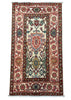 A rectangular traditional oriental rug with a cream center field, red borders, and multicolored floral motifs, photographed flat against a gray background.