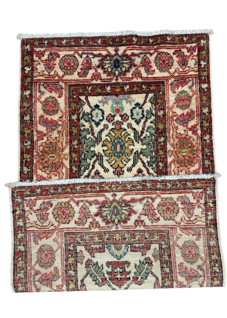 Two vintage Persian-style area rugs with intricate floral and medallion patterns, displayed flat against a gray concrete floor.