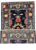A traditional hand-knotted oriental rug with a dark navy blue field, featuring a central floral motif in red, orange, and cream, surrounded by a detailed patterned border. The rug is shown in two overlapping pieces to display its full rectangular shape and white fringe details, laid flat on a neutral gray concrete floor.