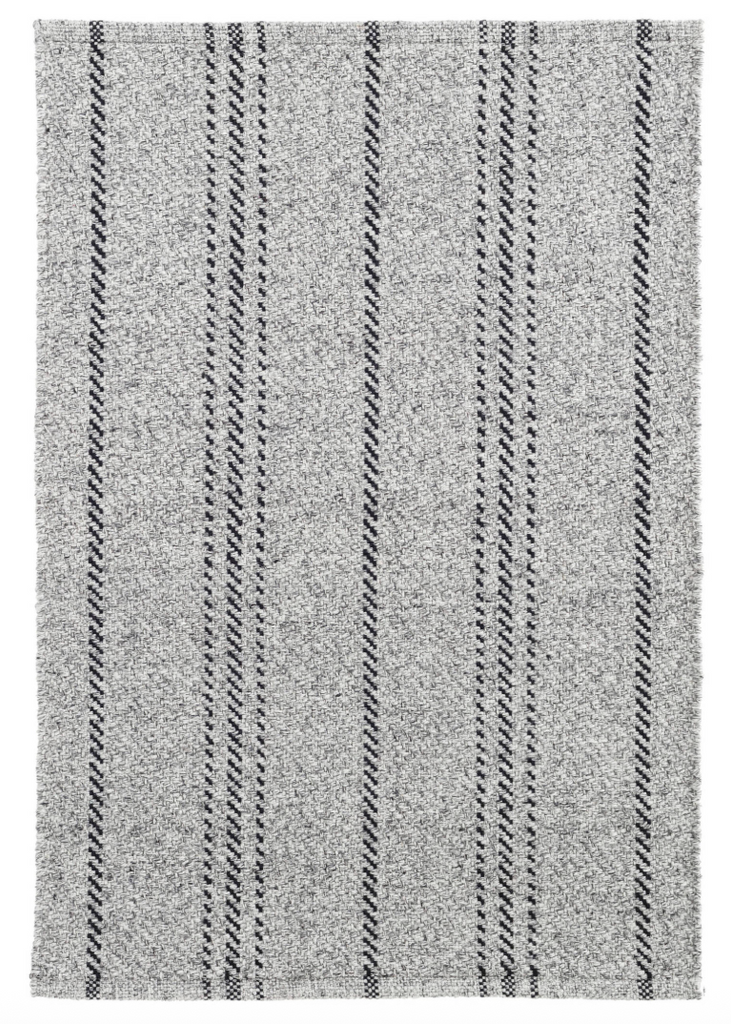 Textured gray rug with black stripes on a heather grey background
