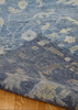 Close-up of a blue patterned rug on a wooden floor