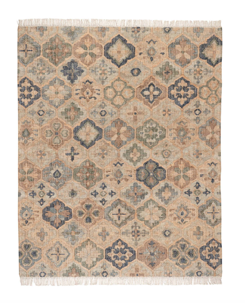 Patterned rug with geometric design on a beige background